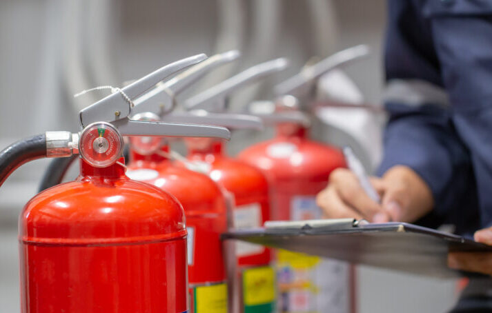 Engineer are checking and inspection a fire extinguishers tank i